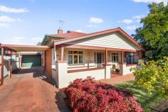 23 Francis Street Cowandilla SA 5033 $890,000 Nestled behind a charming picket fence and row of standard roses, this character bungalow circa 1926 blends perfectly with modern updates. This highly desirable home is situated in one of Adelaide's inner city fringe locations. With its beautiful street appeal, sandstone façade and full length verandah this is a "must have"! The original footprint of the home elegantly spans across timber fretwork, polished timber floorboards, lofty ornate ceilings and pretty fireplaces. A welcoming and gracious hallway offers a central connection to four exceptionally spacious and evenly proportioned rooms allowing you to configure as you wish. A formal lounge (bedroom 4 if preferred) is situated at the front of the home with a divine open fireplace. All three light filled bedrooms are generous in size. The home opens at the rear to reveal a light-filled open plan living, modern kitchen and dining area. The sleek kitchen, overlooking the landscaped rear garden, features Caesarstone bench tops, stainless steel gas oven, integrated dishwasher and breakfast bar/island bench plus loads of pantry space. A classic heritage style bathroom, with cast iron original deep bath, pressed metal wall finishes, vanity, wc and separate laundry with plenty of storage. Direct access through to the workshop is a bonus. Step outdoors to a magnificent pergola covered outdoor area with extensive paving to create a lovely spot for entertaining family and friends. Landscaped gardens with established lawn, gardens beds, and an abundance of fruit trees complete this family friendly home. The children will love the cubby house and the 4-legged friends will be safe in the fully fenced rear garden. Fruit trees include passionfruit, peach, apple, mandarin, grapefruit, lemon, lime and limequat to help keep the grocery bills in check. A sensational location where you can walk to Hilton Plaza Shopping centre, a caffeine hit at Half cup or Devour and public transport is less than 200m away. A short drive to even more shopping, restaurants and cafes on Henley Beach Road and the beaches are just 6kms away. It simply does not get much better than this. Even more to love: - Workshop with built-in storage - 4 reverse cycle split system air-conditioning units - 5 ceiling fans - Polished timber boards, lofty decorative ceilings and timber fretwork - Ornate fireplaces - Full length front verandah - Automatic Irrigation front and rear - Abundance of fruit trees - Cubby house - Picket front fence - Rinnai gas hot water service - Completely re-wired in 2017 - Carport - Security front screen door - Plenty of off-street car parking - Short stroll to Cowandilla Primary - 10 minute drive into the Adelaide CBD - Adelaide airport is less than 3 kms away 