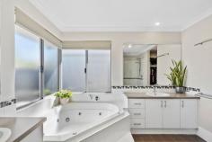  13 Karon Vista Halls Head WA 6210 $799,000 Prepare to be impressed by this spacious and feature-packed home, offering an abundance of space and low-maintenance living.  As you step into the welcoming front portico, you'll be greeted by the lovely morning sun.  This home features four large bedrooms designed for comfort and relaxation. The massive master bedroom is a true retreat, boasting a view of the swimming pool, a generous ensuite with a luxurious spa bath, double vanity, double shower, and his-and-hers walk-in robes. The three additional queen-sized bedrooms come with built-in robes, ensuring ample space for everyone. The second spacious bathroom includes a bath, shower, and wall-length vanity, providing convenience for family and guests.  The heart of the home is the huge open-plan living area, seamlessly combining the living, dining, games, and kitchen spaces. The inviting kitchen is equipped with gas cooking, a breakfast bar, a pantry, a dishwasher, a large fridge space, and ample overhead cabinetry.  For movie enthusiasts, there is a separate theatre room located at the front of the home.  Step outside to your alfresco area, complete with café blinds, and enjoy your morning coffee overlooking your heated swimming pool, promising endless enjoyment. This outdoor living area provides an excellent space for relaxing and entertaining with friends and family.  Additional features include reverse cycle ducted air conditioning for year-round comfort, 16 x solar panels, a double garage with a shopper's entrance, a 6 x 4m powered workshop, and a 1.65m side access (perfect to store your trailer behind secure gates). Conveniently located within walking distance to everything your family needs, this home offers easy access to nearby cafes overlooking the beach and multiple local parks perfect for kids and dogs. With several schooling options just a short walk away, you'll enjoy the low-maintenance living that allows you to spend less time on upkeep and more time enjoying your beautiful surroundings. 