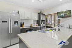  20 Quinn Drive EDMONTON QLD 4869 $570,000 This immaculate house on a generous 660m2 allotment, is designed for any family in search of a spectacular property to call home. Generously sized and capturing an abundance of natural light, this loving home is warm and welcoming from the moment you step inside. The modern galley kitchen features timber toned benchtops, stainless steel appliances and is finished with a central preparation bench, great for interaction within this space. The sliding doors unfold to the huge rear patio, making entertaining and outdoor living easily accessible through the dining and lounge areas. Filled with natural light, the enormous master bedroom includes a walk-in robe, air-conditioning and a well appointed ensuite. A further two wooden floored bedrooms are generously size - much larger than the standard home, provide excellent accommodation for the entire family and are serviced by a main, immaculate bathroom which includes a double shower. Fully fenced, the open and grassy lawn is a great outdoor area, perfect for children to play. This flat space also offers great potential to further landscape or add a pool to suit your desires. The property also has side access - where a landing pad has been made to accommodate a caravan or boat and hosts a fully secured rendered shed - approx. 3m x 4m. The home accommodates a double car remote controlled garage with a polished concrete floor and it has access direct into the home. 6.5 kw solar panels have been installed. Surrounded by great homes in Sugarworld Estate, this residence is a short walk from public transport as well as an array of local parks, plenty of surrounding shops, great schools and sporting prescient. This is an exciting chance to secure a lovely home in a family neighbourhood. 