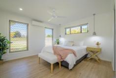  9 Denaid Court Benaraby QLD 4680 $1,200,000 NEARLY NEW: This low-set brick home was built just over three years ago, perfectly designed for modern family living, with a neutral colour scheme throughout, high ceilings, quality fixtures and fittings, sitting proud on a sprawling 8,614m2 which is over two acres. There is an impressive 20m x 9m shed with 4 large roller doors, a double size lean- to carport which is 6m x 9m for additional covered parking. Plus, the shed is equipped with both 10- and 15-amp outlets, a mezzanine floor, a car hoist and there's even a separate shower and toilet block adjacent to the carport for added convenience! Immaculate in every way, inside and outside, and this is what makes this home truly exceptional. Home Features: The kitchen has a 900mm Induction cooktop, Island bench, double sink, dishwasher, walk-in pantry with a coffee station, plus plenty of bench space, and ample soft closing cupboards and drawers. The living, dining and kitchen area is a spacious open plan design with glass louvres to provide stunning views from every angle, and gentle breezes to flow through all year round. Large glass sliding doors open to an expansive undercover area, and seamlessly bring the indoor and outdoor entertaining spaces together, making it just perfect for hosting gatherings or enjoying a quiet evening outdoors. The media room is an ideal retreat for family movie nights, or it can be transformed into a playroom for the kids, plus there is a dedicated separate study nook. The Master bedroom is air conditioned and a super king size room, with an ensuite tiled to the ceiling, double vanity, walk-in shower, and a walk-in robe. There are another three bedrooms, one of them is a king size room, all have built-in robes, air conditioning, while the main bathroom is also tiled to the ceiling and has a separate bath and shower, vanity and a separate toilet. This is an impressive home without doubt, with beautifully manicured gardens and lawns, and a fully fenced separate house yard. An entertaining area thoughtfully designed with concrete bench tops, a place for a pizza oven, seating, a fire pit and lighting, making it a fantastic spot for family and friends to gather!! This property lends itself to those who perhaps want to run a business from home with the extensive shed space, ideal if you have trucks, trailers, extra vehicles or machinery etc, however you may just want to store a caravan, the boat, camping and fishing gear! This gorgeous home offers the perfect combination for families seeking extra space on acreage, modern comforts, and a clean fresh 'Country Lifestyle'. WHY WAIT TO BUILD, WHEN IT'S ALREADY DONE?? Conveniently located only a 15-minute drive to the Gladstone CBD, Tannum Sands Beach and the Boyne River 