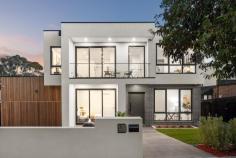  3 Puerta Street Burwood VIC 3125 A statement in architectural excellence, this property utilises bespoke finishes, modern material elements, and premium functionality with spectacular effect. A result of intelligent design and creative vision, the home is a paradise for families underscored by a central position within walking distance of Deakin University and PLC. A bold addition to the streetscape, the facade's geometric forms and striking lines are repeated within, most notably in the statement recessed feature wall adorning the formal lounge. A modern material palette comprising premium hardwood flooring and stone surfaces is sleek, balanced, and distinguished, lending an air of quiet elegance to the interior domains. Outside, an undercover deck links to a private courtyard for multi-setting alfresco entertaining. Combining function with form, the gourmet kitchen is preceded by a stone waterfall island and presents high-volume cabinetry set among wide preparation benches and integrated appliances with a fully-equipped butler's kitchen tucked behind. Paying respect to how families enjoy coming together before retreating into their own space, the casual entertaining zones are cordoned off from the intimate living quarters. A ground floor guest bedroom with WIR & ensuite is situated privately at the entry, and is joined above by four further bedrooms with private ensuites and WIR's. Features include central heating & cooling, floor-to-ceiling bathroom tiling, oversized dimensions, multiple entertaining zones, and bespoke finishes. Placed among the areas leading school and within walking distance of Gardiners Creek and the 75-tram into the city, further advantages of the area include proximity to Burwood One SC, Burwood Brickworks, and Toorak Road shopping districts. 
