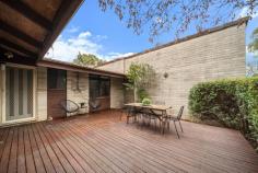  1/61 De Graaff Street Holder ACT 2611 Located within easy walking distance to parklands, schools plus the Cooleman Court shops and restaurants, this welcoming 2-bedroom home is a wonderful suburban oasis. High, vaulted ceilings make every room of this remarkable townhouse feel spacious and special. The renovated kitchen has all the space, storage and inspiration you need for cooking up a storm. The adjacent dining room is perfect for family get-togethers and late night games nights. The home has a lovely flow to it. Step past the open shelves, cleverly used as an aesthetic room divider, and into the sun-filled lounge room. This is the heart of the home and perfect for winding down at the end of the day in front of the box. Reverse cycle air conditioning and a gas log fireplace ensures you're so comfortable all year round you may never want to move again. Tucked away from the main thoroughfare, the master bedroom offers generous space, a built-in robe and a delightful green aspect through the large window. The second bedroom - is perfect as is, or ideal for a transformation into a home office, guest bedroom or nursery. Both rooms offer the sense of space rarely found in townhouses. Outside holds just as many surprises. The front courtyard is private - a lovely little low-maintenance sanctuary - to be enjoyed while relaxing on the front deck. In the centre of the complex is a communal green space which allows you to forget you're in the middle of suburbia. New plush carpet throughout, undercover parking, separate laundry and only one common wall. Whether you're looking to downsize, or you're just starting out, you'll discover that this exceptional home is simply perfect for you. Your new home features: Newly carpeted throughout Renovated kitchen with dishwasher and electric cooktop and oven Bathroom with sunken bath Built-in wardrobes in master bedroom Separate laundry with plenty of storage Reverse cycle split system air conditioning in both master and living room Double glazed windows in the living room Decked courtyard garden Single carport plus additional car space and lockable storage Wonderful neighbours/community - a mix of younger families and long-term residents Nestled in a quiet complex and a short walk to the local Holder shops, Duffy shops and Cooleman Court with Medical Centre, Walk-in Centre and Allied Health Services Close to Duffy Primary, St Jude's Primary School and St Judes Early Learning Centre Preschool, Canberra Montessori School and Orana Steiner School Walking trails to Mount Stromlo Forest Park, Cooleman Ridge and the Holder Wetlands Quick 5 minute walk to R7 bus connection to the city interchange 