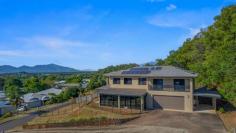  2 Sunbird Drive Woree QLD 4868 $1,295,000 Patrick Kenny proudly introduces to the market a double story home that has the ultimate views of Cairns and down Southwards, approximately 400m under roof GROUND LEVEL • Completely tiled throughout the home • Every room throughout the home has a split system air conditioner • You will be spell bound by the size of the Media room • Magnificent Island servery kitchen completed with a five burner gas cook top, glossy white tiled splashback, abundance of draws, over head cupboards and pantry • Butlers kitchen complete with a double sink, dishwasher, pantry, over head cupboards and a storage room • Large bedroom with built in robes, plus sliding doors that open up to a balcony with Easterly views • Main bathroom with a shower, fully tiled walls to the ceiling plus a toilet • Entry from the dining room into the garage • Adjustable shelving in the garage with an exit door to the carport • The dining room feeds off the well appointed kitchen • Offset from the dining room is a formal lounge room and sliding doors that take you to the outside patio with panoramic views • Enclosed tiled patio with stunning views and tinted windows • Crimsafe security screens throughout the bottom level • Polished timber staircase leads you up to the top level TOP LEVEL • Polished timber staircase leading you up to the top level which is full of surprises • Six bedrooms bedrooms in total and three bathrooms • All rooms fully air conditioned • The master bathroom has a shower, bath and fully tiled walls to the ceilings • Large family room perfect to utilize as a lounge or reading room • Two master bedrooms have walk in robes, ensuite and sliding glass doors that lead you out to a balconies that presents the best possible views of Cairns • All external security doors are Crimsafe • Two linen robes ADDED FEATURES • Completely concreted paths around the home • Security cameras around the home • 5 klw solar panels, only one neighbor • The home was completed in April 2019 