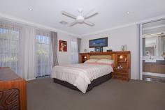  19 Sharperton Meander Dudley Park WA 6210 $689,000 Set in a peaceful area with a reserve opposite, you can simply sit, enjoy, and even watch the wildlife. Walk through the vibrant double-door entrance and be met by bright and modern decor. To the left of the entry is the spacious master bedroom with a separate ensuite, all set in neutral tones, featuring a soothing shower, vanity basin, and toilet. Continuing down the entryway, you will find the separate theatre, ready for family movie nights-get comfortable and break out the popcorn! Let your feet follow you through the home over the cool white tiling into the freshly renovated kitchen, equipped with not one, but two ovens, stone benchtops, ample storage, a dishwasher, and feature lighting. From the kitchen, walk into the open-plan living and dining area and then out onto the composite decked outdoor patio area. This space has been extended and is definitely one you can make your own to revel in relaxation, featuring a pull-down screen for sun and wind protection. Look out from the entertaining area to your own lush gardens with a tropical oasis vibe, or walk along to the left and find a private grassed area, providing the extra space you need for guests, kids running around, and more. This home also includes a study/bedroom, spacious minor bedrooms with built-in robes, a main bathroom with a bath, and a well-equipped laundry. Additionally, there is concrete parking to the left of the home, perfect for a caravan or boat, with the Mandurah Cove close by for those who love a summer day out on the water! 