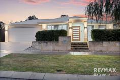  100 Wallangarra Rd Carramar WA 6031 WOW! This stunning residence occupies the largest block in this stage of the highly sought after ‘Wildwood Estate Carramar’ & offers the lucky buyers the freedom of space & tranquillity, yet with all local conveniences so close! Features & benefits include: * Front portico / verandah * Wide door entrance * Entrance hall * Home theatre with recessed ceiling & double doors * Home office/study with built in desks & storage * Master bedroom suite with luxury, fitted walk in robe / dressing room & en-suite with twin vanities, shower & WC * Spacious, open plan family & meals areas * Stunning kitchen with stone bench tops, breakfast bar, large walk-in pantry, & stainless-steel appliances * Activity Area * 3 further spacious bedrooms all with mirrored sliding door robes * Family bathroom with shower, bath & vanity * Powder room * Well-appointed laundry with built in, sliding door linen closet * Ducted, zoned, reverse cycle air conditioning for all year-round comfort * Solar electricity system to offset power bills * CCTV system * LED lighting throughout * Neutral interior design throughout * Quality carpets * Huge undercover entertainment area with drive through access from the garage * Reticulation * Expansive exposed aggregate * Generous grass area with room for a pool * Fruit trees * 9.12m x 4.94m studio, fully insulated, with reverse cycle, split system air conditioning, this would make an excellent work from home space / gym / games room or retreat * Double garage with roller door through access * Side access with double gates & expansive parking for boat / caravan / trailer * Huge 1,398 sqm block 