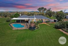  194 Meadows Lane Tamworth NSW 2340 Welcome to 194 Meadows Lane where you can enjoy country living on a parcel of 40 acres right on the outskirts of Tamworth. With breathtaking views of the city lights and surrounding mountains, you will find yourself getting lost in the peaceful life this home has to offer. Boasting five generous size bedrooms in a great floor plan showcasing a central living area with all the bedrooms cascading from this point. The master suite has a modern ensuite and walk in robe attached with the focus point being the picturesque scene out the bay window. You will find split systems and fans in three of the remaining bedrooms offering an extra level of comfort all year round. 'Glenburnie' also offers a private balcony at the front of the home that allows you to capture the tranquilly of Meadows Lane and then inside a huge living space complete with an open fireplace, and plenty of natural light. Adjoining is a separate media area which means there is more than enough space for the growing family. The dining room is finished with polished hard wood floors and flows onto the kitchen which provides an outlook over the inground swimming pool. Enjoy the massive undercover alfresco area and the vast landscape offering fields of vision looking towards Tamworth City whilst entertaining or hosting family gatherings. Could you imagine enjoying your evening in the pool gazing at the mountains and beautiful skies? Then this is the home for you. The property also comes with nine chicken sheds, solar panels, two bores and abundance of shedding and water. 