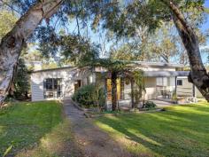  18 Hall Rd Foster VIC 3960 $495,000 Set on approx. 999m2, enjoying a peaceful outlook over the trees and access to the Whipstick Gully reserve for bush walking and mountain biking, yet only a few minutes from the centre of town. With some renovations undertaken already, this is the perfect opportunity to complete the dream. Country style kitchen with stylish 900mm dual fuel range set into the original hearth, timber benchtops and breakfast bar to a light filled meals area. Cosy living room with combustion heater in brick hearth and doors opening out to a private deck. Three bedrooms (one with the romance of a fireplace), master with a sparkling new ensuite bathroom. Main bathroom plus laundry / utility room with separate w.c. Corner block with access to a LU garage / workshop and parking for additional cars, caravans or boats. If you are looking for a country feel with in-town convenience, this property is sure to appeal. 