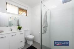  5 Burrowa St Armadale WA 6112 $699,000 Centred on a corner block behind an iron and sandstone fence with an automatic gate and broad front lawn, this family home delivers modern living with spacious interiors, a poolside alfresco entertaining area and a powered workshop with drive-in access. Freshly painted inside and out and boasting a bright neutral palette of colours, tiled floors in the central living areas and warm laminate timber floors in the bedrooms, the home is the perfect setting for generations of making memories. 4 bedrooms 2 bathrooms 1978-built brick and tile Fresh paint inside & out Bright modern kitchen Large junior bedrooms Secure parking for 4 cars Poolside alfresco entert. Drive-in 6 x 7 pwd shed 746 sqm fenced crn lot Steps from local reserve A front porch fashioned from the original carport leads into a small entryway, the perfect drop-spot for bags and keys before continuing straight ahead into a formal dining/playroom and kitchen or turning left into the open plan family room/meals area. Tiles run underfoot in the busy shared living spaces, ensuring a smart, modern look and easy-care practicality. Ducted evaporative cooling provides summer climate control across the home and is supplemented by split systems in the main and two junior bedrooms. A gas bayonet is fitted to the family room. The generously proportioned open-plan living zone flows into the bright, family-friendly kitchen where a U-shaped benchtop surrounds an electric oven, 5-burner gas hob and dishwasher. A white tiled splash back, built-in pantry and ample storage make for stress-free meal prep and clean up. Adjoining the kitchen is a multi-use room that could be styled as a formal dining room or a fantastic playroom, study or screen room where the kids are within eye and earshot while you catch up on their day and prepare dinner. The principal suite sits at the end of the bedroom hallway. It boasts split-system air conditioning, direct access to the alfresco and pool area, a bedroom that will comfortably accommodate a king-sized bed and timber laminate floors. A huge, fully tiled ensuite with a corner spa bath, double shower, double vanity and a triple built-in robe complete this expansive parents’ retreat. A separate WC sits off the hall. All three junior bedrooms boast a wardrobe recess and timber laminate floors. These generously proportioned rooms – large enough for double or queen-sized beds – are sure to delight kids of all ages. They share a fully tiled family bathroom fitted with a shower, vanity and WC. Extending across the rear of the home, the gabled alfresco with retractable blinds is a fantastic living and entertaining space year-round. It has views across the backyard and a below-ground pool. The perfect setting for impromptu alfresco dining, casual barbecues or memorable family celebrations, this multi-use space has ample room for seating, dining and relaxing. A high gate at one side of the property opens to access the powered workshop; a small garden shed is hidden behind a fence at one end of the front porch. No matter the age or stage of your family, this home is up to the demands of daily life. A fully fenced lot gives kids and pets a safe place to run and play and Reg Williams Reserve at the end of the street expands their horizons. The ongoing upgrade of the Armadale line will transform train travel for residents. Local schools, daycare and shopping are all within easy reach. The nearest bus stop is around a 12-minute walk. 