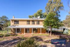  690 Lockwood Rd Beechina WA 6556 $849,000 Nestled along a picturesque country lane, this enchanting two-storey cottage sits on over 6 acres. Orientated to capture stunning views across paddocks and featuring a private east-facing verandah, the modern country home offers rural living with style. Paddocks – one with a shelter – a bore, rainwater tank and rustic farm shed set the stage for a lifestyle property with the potential to keep animals, grow food and bask in the beauty of open space and nature’s splendour. 4 bedrooms 2 bathrooms 2-storey brick & iron home Elegant modern kitchen Split ACs & Slow comb fire Open plan kitchen/meals Family bath with spa tub 3 paddocks, shelter, shed Bore and rainwater tank 2.5 hectare/6.18 acre blk Walk Kep & Heritage trail A formal entry with timber floors opens to a contemporary kitchen and meals area on one side and a spacious family room with a cosy slow-combustion fireplace on the other. The ground floor is bathed in natural light from dual-aspect glazing, with east-facing windows capturing stunning rural vistas. The brick-paved verandah seamlessly blends indoor and outdoor living, making it perfect for entertaining or quiet relaxation. The well-appointed kitchen features glossy cabinets, deep storage drawers, a walk-in pantry, and a generous benchtop with an integrated breakfast bar. Modern appliances, including an induction cooktop, dishwasher, and electric wall oven, ensure meal preparation and clean-up are a breeze. A window over the sink frames serene paddock views, adding a touch of tranquillity to everyday tasks. A timber staircase ascends to the first floor, where you’ll find the bedrooms and a chic family bathroom. The main bedroom, complete with a built-in robe, ceiling fan and split system air-conditioning, is a light-filled retreat with picturesque views. Two junior bedrooms are equipped with split system AC units, while the third bedroom is ideal for a nursery or home office. The family bathroom boasts a walk-in shower, spa tub and vanity, with a separate WC off the landing. A second WC and shower adjoin the ground-floor laundry. The expansive grounds feature paddocks, a shelter, an enclosed entertaining area, and a rustic farm shed, offering a perfect setting for equestrian pursuits, keeping a few sheep or alpacas or growing fruit and vegetables. A productive bore and large rainwater tank make it easy to maintain livestock and cultivate your own produce. Proximity to the Kep Track and Heritage Trail provides endless opportunities for walking and riding, while local schools, Mundaring and Midland are just a short drive away, ensuring a seamless blend of country living and city convenience. 