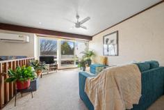  11C/3 Davies Place Torrens ACT 2607 $650,000 Tucked away in a quiet complex of 12 in the coveted suburb of Torrens, this distinctive 2-bedroom, 2-storey townhouse blends post-modern architectural elegance with retro 1970s vibes. Step into the kitchen and you're greeted by the vibrant walls and leafy outlook complementing the wooden cupboards. The kitchen's charm flows into the spacious dining and living area which are versatile spaces ready for your daily meals, grand dinner parties or curling up on the couch with a book. Whether you're home from work or school, the study nook is the perfect spot to get your work done. The living area offers a space which fills with natural light through the wide glass doors that open to the spacious patio. This paved oasis, framed by established trees for privacy, is perfect for entertaining friends or enjoying a quiet moment by yourself in the sun. Downstairs, all bedrooms have built-in robes and copious sunlight through the large windows that look across the garden. Also downstairs, the main bathroom features a full bath and tiling that echoes the home's unique character. This charming home is perfect for young families or downsizers alike. Located in a peaceful neighbourhood, walkable to the local shops and public transport, it offers the rare combination of quiet and convenience. The property's proximity to local schools and nature trails make it clear why Torrens is such a sought after suburb. This classic Canberra home is the perfect combination of "nothing more to do" and "so much potential". Whichever way you go, this townhouse will immediately feel like home. Your new home features: Architect designed by Dirk Bolt Central living area opens out to sunny north facing paved terrace Dual level layout separates living and accommodation zones Charming kitchen with treetop views All bedrooms have built in robes Main bathroom with separate bath/shower Reverse cycle split heating and cooling system in living room Separate laundry Storage nook underneath stairway and linen press by the bathroom Single carport with direct access to property and ample visitor parking Sunny outdoor terrace with treetop views and storage room Wonderful neighbours/community - a mix of younger families and long-term residents Quiet complex surrounded by trees Close to Mt Taylor's walking trail, Torrens shops, Torrens early learning and primary school, Southlands Shopping Centre, Marist College, Woden Westfield and Canberra Hospital. Quick walk to Athllon drive for bus connections to Tuggeranong, Woden, Civic, ANU and Belconnen. 