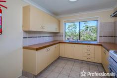  18 Magnetic Drive Tamborine Mountain QLD 4272 $1,050,000 Perched proudly on the hill, this solid home offers impressive views of the Gold Coast and the ocean beyond from the main living areas and the sunny north-facing covered deck. Built in the 1980s, this two-storey brick home exudes durability and charm, reflecting the era when homes were built to last. Although it may need some updating, it remains comfortable and well-maintained, making it an excellent investment opportunity or enjoy as your family home. The home features a bright and airy interior, with abundant windows throughout to capture the breeze. Upon entering through the formal entrance hall via the front veranda, you are greeted by a formal lounge and dining room with views of the coast. The practical kitchen, equipped with electric cooking, offers south-facing views from the window, and the adjacent family dining area opens to the BBQ deck. External door and ramp to the back garden adds convenience. Downstairs, a self-contained living space offers additional flexibility with a bedroom, lounge, kitchenette, and bathroom. This area is ideal for extended family, guests, or potential rental income. Additionally, a “mancave” workshop or dry storage space provides extra room for hobbies or storage needs. Main level: – 3 bedrooms – Family bathroom – Laundry – Separate living room – Dining room – Kitchen – Front and rear deck Downstairs: – 1 bedroom – Family room – Kitchenette – Bathroom Underneath: – Workshop/man cave, dry storage Outside: – Carport – Flat 1,012m2 block – 8 solar panels The very neat mature gardens offer ample space for children to play or for growing vegetables. With two driveways, one leading to the granny flat and one to the upstairs level, and a single carport with room for a garage if desired, this home combines practicality with potential. 