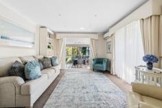 65 Berrys Head Rd Narara NSW 2250 Perfectly fusing a dream address and inspired floorplan with luxe interiors and stunning scenery, this is a family home unlike any other. Nestled within a tranquil enclave of sought-after Narara, this leafy tree-lined street welcomes you to No. 65, a quality-built oasis lovingly recrafted and upgraded throughout to offer exceptional family living and entertaining. Spread across two enticing levels, a free-flowing design encompasses multiple formal and informal living zones, an exquisite modern kitchen, five generously proportioned bedrooms, and a dedicated bathroom on each level. There’s so much to discover and plenty of surprises in store, including a fully equipped outdoor kitchen on the lower level, spilling out from the family rumpus to offer an incredible backdrop to seasons spent relaxing and enjoying this phenomenal position. Features include: – Premium lifestyles address just moments to every suburban convenience. – Tranquil family retreat; beautifully renovated and artfully upgraded throughout. – Opulent designer aesthetic throughout, accentuated by immersive natural views from every angle. – Dual-level floorplan offering spacious living and entertaining quarters across each level. – Inviting foyer welcoming you into the upper level, where a stunning sunroom showcases floor-to-ceiling north-westerly views of the grounds and trees beyond, gracefully connecting a main family lounge and an exquisite gourmet kitchen/meals zone. – Three large bedrooms also rest on this level (all with built-in robes), including a lavish master suite along with an indulgent family bathroom. – Fabulous ground floor offering a spacious rumpus room, two large bedrooms, a bathroom, and laundry before spilling outside to a superbly covered entertaining zone complete with an external kitchen, chic dining area with sparkling downlights, and drop down window blinds designed to cater to all weather conditions. – Bonus paved patio zones offer a selection of spaces to sit back, relax, and unwind. – Fully fenced backyard (with multiple gated areas) framed by established trees; blissfully peaceful and private, with plenty of room for kids and pets to run and play. – Dual garaging with mezzanine storage, internal access, and drive-through access to the rear courtyard. – Fully landscaped grounds and gardens across this generous 904sqm allotment, featuring a vibrant array of Xylosmas, Star Jasmine, Dwarf Date Palms, Lilly Pillies, and Murraya hedging, along with striking mature gumtrees and golden cane palms. Extras include: abundance of storage throughout; split system air conditioning (upstairs living, downstairs rumpus room + 2 bedrooms); a dream outdoor kitchen with a fully plumbed fridge, dishwasher, and sink (lower level); a garden shed or storage space (under-house); a back-to-base alarm; and fibre to the node internet. Narara itself is prized for its distinct natural beauty and incredible accessibility to all amenities, with a diverse selection of local shops, schools, and services close by, along with great public transport (bus and train stations). Narara Train Station is close by (1.1 km), while access to the M1 is within easy reach (less than 10 minutes away) for seamless connection through to Sydney or Newcastle, perfect for commuters, while all the lifestyle benefits of the Central Coast (beautiful beaches, bushwalks, and waterways) can be found within a 15–30 minute radius. Make your move fast on this one! 