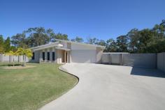 9 Denaid Court Benaraby QLD 4680 $1,200,000 NEARLY NEW: This low-set brick home was built just over three years ago, perfectly designed for modern family living, with a neutral colour scheme throughout, high ceilings, quality fixtures and fittings, sitting proud on a sprawling 8,614m2 which is over two acres. There is an impressive 20m x 9m shed with 4 large roller doors, a double size lean- to carport which is 6m x 9m for additional covered parking. Plus, the shed is equipped with both 10- and 15-amp outlets, a mezzanine floor, a car hoist and there's even a separate shower and toilet block adjacent to the carport for added convenience! Immaculate in every way, inside and outside, and this is what makes this home truly exceptional. Home Features: The kitchen has a 900mm Induction cooktop, Island bench, double sink, dishwasher, walk-in pantry with a coffee station, plus plenty of bench space, and ample soft closing cupboards and drawers. The living, dining and kitchen area is a spacious open plan design with glass louvres to provide stunning views from every angle, and gentle breezes to flow through all year round. Large glass sliding doors open to an expansive undercover area, and seamlessly bring the indoor and outdoor entertaining spaces together, making it just perfect for hosting gatherings or enjoying a quiet evening outdoors. The media room is an ideal retreat for family movie nights, or it can be transformed into a playroom for the kids, plus there is a dedicated separate study nook. The Master bedroom is air conditioned and a super king size room, with an ensuite tiled to the ceiling, double vanity, walk-in shower, and a walk-in robe. There are another three bedrooms, one of them is a king size room, all have built-in robes, air conditioning, while the main bathroom is also tiled to the ceiling and has a separate bath and shower, vanity and a separate toilet. This is an impressive home without doubt, with beautifully manicured gardens and lawns, and a fully fenced separate house yard. An entertaining area thoughtfully designed with concrete bench tops, a place for a pizza oven, seating, a fire pit and lighting, making it a fantastic spot for family and friends to gather!! This property lends itself to those who perhaps want to run a business from home with the extensive shed space, ideal if you have trucks, trailers, extra vehicles or machinery etc, however you may just want to store a caravan, the boat, camping and fishing gear! This gorgeous home offers the perfect combination for families seeking extra space on acreage, modern comforts, and a clean fresh 'Country Lifestyle'. WHY WAIT TO BUILD, WHEN IT'S ALREADY DONE?? Conveniently located only a 15-minute drive to the Gladstone CBD, Tannum Sands Beach and the Boyne River 