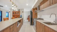  2 Sunbird Drive Woree QLD 4868 $1,295,000 Patrick Kenny proudly introduces to the market a double story home that has the ultimate views of Cairns and down Southwards, approximately 400m under roof GROUND LEVEL • Completely tiled throughout the home • Every room throughout the home has a split system air conditioner • You will be spell bound by the size of the Media room • Magnificent Island servery kitchen completed with a five burner gas cook top, glossy white tiled splashback, abundance of draws, over head cupboards and pantry • Butlers kitchen complete with a double sink, dishwasher, pantry, over head cupboards and a storage room • Large bedroom with built in robes, plus sliding doors that open up to a balcony with Easterly views • Main bathroom with a shower, fully tiled walls to the ceiling plus a toilet • Entry from the dining room into the garage • Adjustable shelving in the garage with an exit door to the carport • The dining room feeds off the well appointed kitchen • Offset from the dining room is a formal lounge room and sliding doors that take you to the outside patio with panoramic views • Enclosed tiled patio with stunning views and tinted windows • Crimsafe security screens throughout the bottom level • Polished timber staircase leads you up to the top level TOP LEVEL • Polished timber staircase leading you up to the top level which is full of surprises • Six bedrooms bedrooms in total and three bathrooms • All rooms fully air conditioned • The master bathroom has a shower, bath and fully tiled walls to the ceilings • Large family room perfect to utilize as a lounge or reading room • Two master bedrooms have walk in robes, ensuite and sliding glass doors that lead you out to a balconies that presents the best possible views of Cairns • All external security doors are Crimsafe • Two linen robes ADDED FEATURES • Completely concreted paths around the home • Security cameras around the home • 5 klw solar panels, only one neighbor • The home was completed in April 2019 