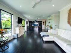  20 Fitzpatrick Street WALKERSTON QLD 4751 $499,000 Welcome to a residence that effortlessly blends style, elegance, and comfortable living amidst the lush tropical setting of Walkerston's semi-rural charm. This is more than just a home; it's a haven where you can relish peace and serenity without the hassles of high maintenance. Crafted with a meticulous eye for detail and a seamless indoor/outdoor lifestyle in mind, this exquisite property boasts top-notch fittings and finishes that elevate your living experience. Key Features: 1. Three Luxurious Air-Conditioned Bedrooms: The master bedroom features an enviable ensuite and a spacious walk-in robe 2. Sleek Designer Kitchen: A stylish, modern kitchen equipped with high-quality appliances awaits the culinary enthusiast in you 3. Open-Plan Living: The open-plan indoor living area effortlessly extends to a rear entertaining deck, creating a harmonious flow between spaces 4. Custom Outdoor Kitchen: Enjoy alfresco dining in style with a custom outdoor kitchen, surrounded by serene gardens 5. Double Lock-Up Garage: Your vehicles will find shelter and security in the spacious double garage 6. Impressive Corner Block: This 551sqm corner block residence boasts an impressive street presence, setting it apart 7. Solar Panels: Embrace eco-friendly living with the added benefit of solar panels Nestled in the heart of Walkerston, this location offers the best of both worlds-rural tranquility with city conveniences just a stone's throw away. You'll find supermarkets, schools, medical facilities, sporting clubs, and hotels, all within easy reach. Don't miss the chance to make this tropical oasis your own. 