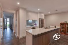  Unit 32/23 Atlantic Dr Pakenham VIC 3810 $540,000 - $580,000 This stylish and low-maintenance four-bedroom townhouse is perfectly positioned in the sought-after Cardinia Lakes Estate. Ideal for first home buyers, families, and investors, this home is sure to be the one you've been waiting for. With contemporary finishes throughout and plenty of space for the entire family, the open-plan living, dining, and kitchen area serves as the heart of the home. The modern kitchen is equipped with stainless steel appliances, a dishwasher, a gas cooktop, and ample storage centered around a chic island bench. Upstairs, the master bedroom features a private ensuite, while the remaining three bedrooms include built-in robes and share the main bathroom and a separate toilet. Additional features include ducted heating, split system air conditioning, a dedicated study nook, a convenient powder room, a low-maintenance courtyard, and a double remote-controlled garage. 