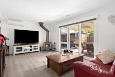  5 Allington Place Langwarrin VIC 3910 $749,000 - $799,000 Holding a privileged address within one of Langwarrin's most convenient enclaves, this beautifully enhanced home delivers instant appeal for modern families or retirees seeking a hassle-free lifestyle in the heart of Langwarrin. Brimming with space and seclusion, the three-bedroom home artfully blends modern updates with thoughtful inclusions to create an inviting setting across two distinct living zones, open dining space and an almost-new kitchen. Making entertaining on a large scale an easy task, the culinary domain features a large walk-in pantry, Westinghouse pyrolytic oven, a 900mm gas cooktop, soft-close cabinetry and stone waterfall benchtops. A fluid indoor-outdoor design promises perfect all-season space, as a large covered alfresco links with a protected above-ground spa, and a rear yard with a fire pit and garden shed. The three-bedroom 2-bathroom floorplan keeps kids together within a private wing alongside the main bathroom with separate toilet, while the master bedroom with walk-in robe and dual-vanity ensuite provides parents with their own privacy. A solid wood heater brings a natural warmth across the rear entertaining footprint, while split-system heating and cooling and gas ducted heating offer push-button convenience. Complete with plantation shutters, ceiling fans, a fully-lined single garage with internal access and a rear storage room, a 6.5kW solar system and ample off-street parking inclusive of separate caravan/boat storage. A convenient position only paces from Langwarrin Plaza, Woodlands Primary School and public transport sees Langwarrin's amenity-rich landscape remain within easy reach. 