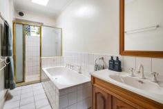  3 Neil Street Frankston South VIC 3199 $1,085,000 - $1,190,000 Sweetwater seclusion with beachside position Situated within one of Frankston South's most tightly-held pockets just steps from Sweetwater Creek and Frankston Beach, this spacious five bedroom residence provides an ambiance of coastal privacy. Reflecting its sensational beachside lifestyle with ample light and a low-maintenance ease, the modest design caters to the needs of young families, first-time buyers and investors alike with a perfect blend of comfort and endless future potential. Set wide across the block with still the ability for side vehicle access, the single-level home showcases a much-loved interior where a history of quality upkeep is evident across the zones. With two generous living spaces each featuring expansive windows, an open dining domain and a centralised kitchen with freestanding Technika cooker, dishwasher and island bench, its social hub provides comfortable family dynamics for both young and older families. Convenient deck access transitions from the secondary lounge, unveiling a generous outdoor dining space perfect for the warmer months. The elevated vantage point offers a sweeping view of the expansive rear yard; where established trees create a truly private sanctuary for little adventurers. Gas ducted heating and evaporative cooling keep the home comfortable across the seasons, while the clever layout sees all five bedrooms keeping the family close-by at night. Two main bathrooms, a powder room, open laundry space, under-deck storage, rear storage room, double carport and dual front gates all provide a comfortable living experience with potential for enhancement, while a FHSZ address only paces from Olivers Hill Boat Ramp, Little Olly's coffee and Frankston's major retail ensures a convenient coastal living experience. 