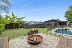  9 Nature Place Buderim QLD 4556 Located in the heart of Buderim, this modern designer home offers a perfect blend of style and convenience, close to top schools and essential amenities. Experience contemporary living with an open plan design that seamlessly connects the kitchen, dining, and living areas. High ceilings enhance the space with natural light, creating an inviting atmosphere ideal for both relaxation and entertaining. The kitchen is a culinary dream, featuring premium appliances, gas cooking, a well-appointed butler's pantry, and sleek matte black finishes. An additional media room provides versatile space for various needs. The master bedroom is a retreat with its ensuite, twin vanity, and walk-in robes. Three more bedrooms offer ample storage and split system air conditioning for personalised comfort. A double garage with side access and extra space for a trailer or camper van simplifies parking. The expansive yard boasts an entertaining deck overlooking the pool and a lush reserve backdrop. With stylish, high-quality finishes throughout, this home delivers luxurious living and modern functionality! 