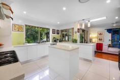  11 Yandala Place Tallebudgera QLD 4228 $1,595,000 When you cherish peace, privacy and natural beauty, this is the sanctuary you've been waiting for. Tucked away in complete tranquillity on a 1.38 acre estate, where towering trees unite with vast open green spaces and a gentle summer creek, it's as if the world melts away once you arrive. A single level home welcomes you at the end of a long driveway, showcasing a renovated stone-clad entry amongst tropical greenery. Views of the glorious grounds follow you throughout, including in the gourmet chefs kitchen. Ample storage, acclaimed appliances and a breakfast bar ensure it's as functional as it is stylish, with the adjacent living room promising a cosy place to curl up by the fire. A formal lounge and dining room and sunroom also feature, providing the freedom to spend time together or apart, along with four spacious bedrooms and two bathrooms. Led by an oversized master suite with walk-in robe and ensuite, it's a lovely place to retreat at the day's end. It's outdoors though that will soothe your soul. Dive into the refreshing saltwater pool or soak away any stress in the spa, all while enveloped by a blissful bushland canopy that ensures complete privacy. The poolside pavilion offers another vantage point to take in the natural wonderland, as does the wraparound alfresco entertaining area, perfect for hosting guests against a stunning bushland backdrop. Additionally, take advantage of secure parking for five cars across two separate carports plus a 6m x 6m double bay work shed with a large, covered annexe. Ideally located to deliver both seclusion and convenience, Tallebudgera State School and St Andrews Lutheran College await within approx. 10 minutes. When you're craving surf and sand, pick between the pristine Burleigh, Palm Beach and Currumbin coastlines, situated within a 15-18 minute radius. Experience this estate's enchantment, serenity and seclusion first-hand – arrange an inspection today. House Features: Single level home with a renovated stone-clad entry, immersed within tropical greenery Lush and leafy views of the estate follow you throughout the home Renovated kitchen with 6-burner gas cooktop, centre island with Vintec wine fridge, Miele dishwasher, ample storage, breakfast bar and leafy views Living room with cosy fireplace Formal lounge and dining room flows into an enclosed sunroom Oversized master suite with walk-in robe and ensuite Four spacious bedrooms with built-in robes ( one currently used as office ) Main bathroom with separate toilet Laundry with external access Oversized carport Ducted air-conditioning Ceiling fans throughout Vast wraparound alfresco entertaining area, refurbished with new roof Saltwater pool and spa surrounded by a blissful bushland canopy Poolside pavilion with spa Property Features: 1.38 acre estate punctuated by towering trees, a summer creek and open green spaces Set well back from the street, accessed by a sealed and forked driveway 6.5m x 6m double carport 6m x 6m double bay work shed with 5.4m x 2.5m covered annexe 3m x 3m garden shed Water tank 7,500 litres 26 solar panels NBN Location: Approx. 6 mins to Tallebudgera State School Approx. 10 mins to St Andrews Lutheran College Approx. 13 mins to The Pines, Elanora Approx. 15 mins to Burleigh Heads Approx. 16 mins to Palm Beach Approx. 18 mins to Currumbin Beach Approx. 24 mins to Gold Coast Airport Approx. 29 mins to Surfers Paradise 