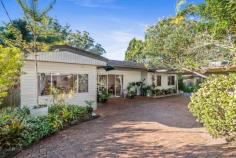  21 Berrys Head Rd Narara NSW 2250 $1,100,000 Be ready to escape to your very own lush green, tranquil oasis. Presenting this spacious 5-bedroom multi-level family home set on a massive 1682sqm parcel of land. You will feel miles away from everything yet still be within easy reach of every suburban convenience. Local shops, cafes, supermarkets, and schools are all just minutes away. This appealing property brings together functionality and space, offering multiple living areas with neutral tones throughout, showcasing an incredible natural outlook across lush green and private surrounds. Perfectly peaceful setting to suit a broad array of buyers, with flexible options for work from home and/or multi-generational living. Super conveniently located with easy walk to bus and train. A must to see! Features include: – Stunning family sanctuary set on an oversized 1,682sqm allotment. – Light-filled throughout with a natural green outlook from every window. – Five bedrooms in total. The master bedroom and ensuite flow seamlessly through the sliding doors out to the covered deck – all with a lush green outlook. – The huge, covered deck at the rear takes in the stunning Narara Valley view and scenic outlook, with the café blinds offering all-year-round comfort – the perfect space to entertain with family and friends or relax with a cup of tea or glass of wine after a busy day. – Lower level offers the perfect parents/teenage retreat – another bedroom, sitting room, and third bathroom – all spilling out to the generous, lush, fully fenced rear yard. This is an incredible space that will suit large or multi-generational families, offering ample space for the whole family. – Family kitchen with island bench, white cabinetry, gas cooking, and an abundance of storage, all set overlooking the covered alfresco area. – Multiple living areas with a combination of formal and informal areas over both levels, offering own space for everyone in the family. – Fresh family main bathroom with separate bath and shower. – The outdoors is a lush green private oasis with a sparkling swimming pool surrounded by a blend of soft grass and advanced landscaped gardens. The extensive gardens offer an abundance of advanced trees and gardens combining soft, lush grass, fishponds, and aviaries, all surrounded by nature. There is plenty of space on offer for the kids and pets to play and explore all year round – kick the soccer ball or trampoline/swing set along with ample space for the avid gardener to potter. – Plenty of parking: double car port plus additional off-street parking – Solar panels: 6.5 kW. – Brilliant package offers the dreamy acreage feel without the big maintenance. Extras include: abundance of storage, gas cooking, and heating, ceiling fans, 3 x reverse-cycle air conditioning units, 2 x garden sheds, and solar panels (6.5kW). Conveniently located near all suburban amenities, Narara has everything you could need, from reliable public transport to a quality selection of schools, local shops, cafes, and supermarkets all just minutes away. Public transport is close by, and easy access is available to the M1 motorway, placing Sydney and Newcastle within easy reach for commuters. Gosford CBD and waterfront, the shopping mecca of Erina Fair, and a selection of magnificent beaches are also within a short drive. 