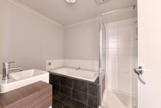  Unit 32/23 Atlantic Dr Pakenham VIC 3810 $540,000 - $580,000 This stylish and low-maintenance four-bedroom townhouse is perfectly positioned in the sought-after Cardinia Lakes Estate. Ideal for first home buyers, families, and investors, this home is sure to be the one you've been waiting for. With contemporary finishes throughout and plenty of space for the entire family, the open-plan living, dining, and kitchen area serves as the heart of the home. The modern kitchen is equipped with stainless steel appliances, a dishwasher, a gas cooktop, and ample storage centered around a chic island bench. Upstairs, the master bedroom features a private ensuite, while the remaining three bedrooms include built-in robes and share the main bathroom and a separate toilet. Additional features include ducted heating, split system air conditioning, a dedicated study nook, a convenient powder room, a low-maintenance courtyard, and a double remote-controlled garage. 