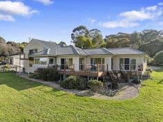  23 Powells Rd Foster VIC 3960 $1,185,000 Set on approx 1 ha of useable fenced land in the popular Golden Creek area at the base of the Hoddle range, just 8 mins from Foster, 10 mins from beautiful Waratah Bay beach, 15 mins to Wilson's prom gateway, this appealing property has been fastidiously maintained inside and out. Cleverly designed to maximise the outlook over the surrounding countryside and glimpses of Wilsons Prom. Offering the perfect alternative to a new build. Energy saving features include double glazing, solar power on a high feed in, zoned RC/AC for heating and cooling in living areas, office and main bedroom. Stunning polished jarrah flooring compliments the neutral décor and every living space opens out onto a deck - perfect for entertaining. Light filled living room with stylish Jotul wood heater. Superbly appointed central kitchen with rich timber cabinetry, stainless steel appliances and a large breakfast bar to the dining room. Master bedroom with WIR & ensuite bathroom plus a light filled home office/4th bedroom with perfectly placed picture windows. Upstairs to a spacious family room with raked ceilings, extensive glazing and balcony with pastoral views. Two further fitted bedrooms are serviced by a central family bathroom. The interior layout is ideal for accommodating a growing or extended family, or even to utilize part as a BnB. There are so many thoughtful inclusions - a large light filled laundry with stone bench, extra-large double garage with auto doors, storage area & direct access to the home. Additional garage/shed/workshop/studio with concrete floor, lights, power & water plus graveled parking area for a boat/caravan. Established vegetable beds & 60,000l of static water. Fenced paddock with room for a few sheep, alpacas or a pony. Sure to delight even the most fastidious buyer this is a property you will love to come home to. 