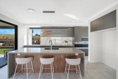  72 Collaroy Parade Louth Park NSW 2320 Baird Real Estate Maitland is delighted to present one of Hillview Estate’s finest family homes, located on the elevated side of Collaroy Parade with uninterrupted views across to the Barrington Tops National Park. From the moment you step through the impressive over size double doors into the 3 metre entry foyer, you’ll be captivated by the extraordinary proportions of this contemporary home. This brand new, custom built, double storey Clarendon home offers an unparalleled semi-rural lifestyle just minutes from Greenhills, the new Maitland hospital, and the Hunter Expressway. The property itself features five bedrooms, including master suites on both the ground floor and the second storey, five bathrooms with full floor to ceiling tiling, along with a ground floor office, theatre, family, and rumpus areas complete the picture perfectly accommodating the largest of families. The sleek, modern interiors boast an open floor plan, highlighted by the designer dream kitchen at the heart of the home. This kitchen features a 2.8 metre island bench with 40mm stone benchtops complete with waterfall edge, and is equipped with SMEG appliances, including an induction cooktop, combination wall ovens, microwave, integrated dishwasher, and a butlers pantry. Nestled on a landscaped 1653m2 block, this property includes many more extras and upgrades. An inspection is highly recommended. 