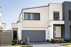  3 Bookleaf Road Botanic Ridge VIC 3977 $600,000 - $639,000 Showcasing a harmonious blend of contemporary design and modern convenience, this three-bedroom townhouse is ideally located just blocks from Botanic Ridge Primary School and Homestead Park. It provides couples and young families with a seamless living experience that embraces a leisure-focused lifestyle without the upkeep. Low-maintenance gardens accentuate a contemporary exterior, while inside features a welcoming ground-floor social domain and a private first-floor accommodation zone, ensuring the perfect balance of privacy and connectivity for young families. Both open and airy, the rear social domain fosters family connection within the living and dining areas, integrating seamlessly with a sun-drenched patio and a stone-finished kitchen comprising sleek stone benchtops, gas cooktop and underbench oven, and direct laundry access with private powder room. Keeping privacy at the forefront with plantation shutters across all first-floor bedrooms, the accommodation comprises three bedrooms including the master with ensuite and walk-in robe, and a main bathroom with oversized shower and single vanity with under bench storage. With split-system heating and cooling, discrete storage throughout, rear water tank, an outdoor roller blind and a double garage with internal access, this impressive two-storey home delivers an appealing residential proposition in the heart of Botanic Ridge, moments from Botanic Ridge Village, Bluebird Early Education, and public transport. 