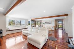  4 Pavana Court Clinton QLD 4680 $690,000 Welcome to 4 Pavana Court, Clinton-a distinguished residence that perfectly blends modern comfort with elegant design. Nestled in a peaceful cul-de-sac, this home offers a serene sanctuary for families and entertainers alike. Built by Peter Hill Homes and designed by Barry Rae Architects, it stands as a testament to quality craftsmanship and thoughtful architecture. The property boasts four spacious bedrooms or three bedrooms and a study as well as three well-appointed bathrooms, providing ample accommodation for family and guests. The master suite is a luxurious retreat, featuring a walk-in wardrobe and an ensuite bathroom. The additional bedrooms are equally inviting, each with built-in wardrobes and access to the upper deck, where you can enjoy breathtaking views and the tranquillity of the surroundings. Upon entering the home, you are greeted by a vast open-plan living and dining area that serves as the heart of the home. This space is designed for seamless entertaining and family gatherings, with floor-to-ceiling windows and sliding doors that flood the area with natural light and offer direct access to the expansive lower deck. The modern kitchen is a chef's delight, equipped with a premium Bosch stove and oven with Fisher and Paykel dishwasher, ample cabinetry, and a central island that combines functionality and style. A flexible space on the half level serves as a study or a fourth bedroom, complete with built-in storage solutions to cater to your family's needs. The main bathroom is thoughtfully designed with modern fixtures, while a practical laundry room provides direct access to outdoor areas for efficient household management. The outdoor spaces of 4 Pavana Court are truly exceptional. The property sits on 1,021 square meters of beautifully landscaped gardens, featuring mature palm trees and native plants that create a private oasis for relaxation and play. The expansive deck areas are perfect for alfresco dining and entertaining, enhanced by the property's northeast-facing aspect, which maximises sunlight and captures stunning views of the surrounding landscape. The ground floor features a spacious double garage and an adjacent workshop, perfect for car enthusiasts or DIY projects. This area offers 73 square meters of parking and storage space, ensuring ample room for all your needs. A conveniently located bathroom on this level adds to the home's practicality. Additional features of this home includes eco-friendly solar panels that provide sustainable living and reduce energy costs. Located in a family-friendly neighbourhood, this home is conveniently situated near schools, parks, shopping centres and 24/7 gym, all within a 5 minute drive offering easy access to all necessary amenities. Constructed in 1990, this home offers 187 square meters of thoughtfully designed living space, making it a perfect blend of sophistication and practicality. Experience the exceptional lifestyle offered by 4 Pavana Court, Clinton, where luxury meets tranquillity. 