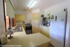  20 Wildcherry Avenue Castletown WA 6450 Discover this well-maintained 3 bedroom brick veneer and tile home, perfect for owner occupier or those looking for a neat investment. The property boasts a formal lounge, a compact yet functional kitchen with a walk-in pantry, and an adjacent dining area. Enjoy the warmth and elegance of new timber floor coverings throughout with added bonus of 2 airconditioning units. The recently remodeled bathroom and laundry add a touch of luxury, ensuring modern comfort. Step outside to the inviting patio, with approval for extension with works about to commence- ideal for entertaining plus convenient rear yard access to a powered double garage. Additionally, a single carport under the main roof offers extra parking or storage space. 