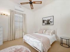  11 Croesus St Kalgoorlie WA 6430 $585,000 You've likely admired this stunning home from afar, and now is your opportunity to make it your own. This stately "Lady" stands as the envy of the neighborhood, with her impressive street appeal, featuring a charming bullnose veranda and a wrought iron fence that warmly welcomes you inside. Boasting timeless character features such as magnificent, high tin ceilings, and stained-glass panels, this home beautifully blends the classic with the modern. A contemporary white kitchen, along with updated bathrooms and laundry, adds a modern twist to its vintage charm. For hobbyists or car enthusiasts, this property offers not one, but two spacious sheds. Both the house and sheds are equipped with a camera security system, along with a doorbell featuring a camera and speaker for added peace of mind. Your comfort is assured with a wood fireplace, two evaporative air conditioners, and four reverse-cycle split systems. Outside, the timber deck shaded by a Jacaranda tree, invites you to relax with a glass of wine. Entertain guests in the dining area, where open French doors allow the serenity of the peaceful garden to flow inside. Key Features: • 3 spacious bedrooms • 2 bathrooms (ensuite and family bathroom) • Elegant white chef’s kitchen with island bench • Induction cooktop, dishwasher, and step-in pantry • Spacious dining area • Modern laundry with ample storage • Cosy sitting area with a fireplace • French doors leading to the rear timber deck • Well-established, reticulated garden • Shed 1 (approx. 6m x 4m) • Shed 2 (approx. 9m x 6m including carport) • Wide solar-powered gate from the lane • Security mesh flyscreens on all windows • Steel stumps beneath the house extension • Front timber stumps re-stumped as needed • Council rates $2215.35 approx. • Water rates $285.00 approx. 