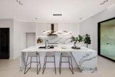  12A Ogmore Court Bankstown NSW 2200 $1,549,950 Welcome to this brand-new, tropical-inspired duplex, tucked away in a peaceful cul-de-sac in the heart of Bankstown. This architecturally designed home is the epitome of modern elegance and functionality, offering the perfect balance of style, comfort, and convenience for families. *Unmatched Design & Livability* Step inside to discover a light-filled open-plan layout, where the centerpiece is the beautifully crafted kitchen. Featuring: - A glass-enclosed walk-in pantry for seamless organization. - A breathtaking 3-meter stone island waterfall bench, ideal for entertaining or casual family meals. - Premium appliances, ensuring a chef's delight in every meal preparation. This space flows effortlessly into the outdoor alfresco area, complete with a covered pergola and a low-maintenance backyard- perfect for year-round entertaining or relaxing with loved ones. *Prime Location* Situated just a 15-minute walk from the upcoming Bankstown Metro train station (completion expected in 12 months), this home puts you within easy reach of everything: shops, schools, clubs, churches, temples, and more! *Key Features* - 5 Spacious Bedrooms: Four upstairs, including a luxurious master suite with an en-suite and walk-in robe. The fifth bedroom/ home office is conveniently located downstairs - ideal for guests or elderly family members. - Luxurious Electric Fireplace: A sleek centerpiece that adds warmth and charm to the living area, perfect for cozy winter evenings. - Sky-Lit Brilliance: Strategically placed skylights ensure an abundance of natural light, creating a bright and airy ambiance throughout the day. This property is not just a home; it's a lifestyle upgrade waiting for its new owners. Don't miss the opportunity to secure your dream family home in this highly sought-after location. 