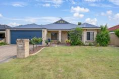  25 Bopeechee Way Port Kennedy WA 6172 $699,000 Set in the tranquil streets of Port Kennedy, this well-presented 4-bedroom, 2-bathroom home is the perfect choice for a growing family. Situated on a generous 448sqm block with lovely street appeal, this home is conveniently located just minutes from local schools, Warnbro Fair Shopping Centre, parks, and public transport. Positioned at the front of the home, the master bedroom boasts a bay window, walk-in robe, private ensuite, and a serene parents' retreat for added comfort. Enjoy a separate lounge at the front of the property for relaxed evenings, plus an expansive open-plan living and dining area with downlights and tiled flooring. Towards the rear of the property are 3 great sized minor bedrooms, which are serviced by a central bathroom and laundry.  Never be short of space with the spacious open-plan dining and living area which is fitted with down lights and tile flooring. The central kitchen offers plenty of bench space and overlooks the meals area and family room, plus you have the added bonus of a games room at the rear of the home  Outside, a large L shaped patio creates the ultimate outdoor entertainment area for gatherings or quiet relaxation.  The grassed yard is perfect for kids and pets to play. Features include: • 4 bedrooms, 2 bathrooms • Formal lounge • Games room • Meals/living and kitchen with shopper's entry • Stone bench tops in kitchen and updated oven and cooktop • Master bed with bay window, ensuite & WIR • Stainless steel oven/rangehood • Ducted evaporative A/C and two split systems  • L shaped gabled/flat patio • Large backyard • Pedestrian access to backyard • Instantaneous gas water heating • Powered shed • 25 solar panels - 6.0 kw 