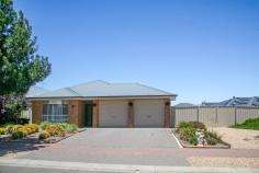  4 Pedler Boulevard Freeling SA 5372 Located in the tranquil township of Freeling, 4 Pedler Boulevard presents a modern and spacious family home offering a perfect blend of comfort, functionality and style. Built in 2016 this immaculately maintained property is an ideal choice for those seeking a low-maintenance, contemporary lifestyle in a peaceful setting. The home is also conveniently located close to local parks and schools, making it an excellent choice for families. Upon entering the home, you are welcomed by high 9-foot ceilings that create a sense of space and openness throughout. The modern tiled flooring flows seamlessly from the entrance through to the living areas, ensuring easy upkeep and a sleek polished look. The open-plan living, dining and lounge spaces are flooded with natural light creating an inviting atmosphere perfect for both relaxation and entertaining. The home features three good-sized bedrooms, all carpeted for added comfort. The master suite is a standout offering a private ensuite and a generous walk-in robe, ensuring ample storage space and convenience. The additional bedrooms are also spacious providing flexibility for family living, a home office or guest accommodations. There are two well-appointed bathrooms including the master ensuite, both featuring modern finishes and clean neutral tones. The main bathroom includes a separate shower and bath, perfect for families with young children. The kitchen designed for functionality, features ample storage space including a walk-in pantry. It is equipped with both gas and electric appliances, alongside a dishwasher ensuring cooking and cleaning are a breeze. The kitchen flows effortlessly into the open-plan dining and living areas allowing for easy interaction while entertaining guests. For those seeking a quieter retreat the formal lounge provides a cozy carpeted area for family movie nights or quiet relaxation. The home also features a large laundry with abundant storage, plus sliding door access to the outdoor clothesline for added convenience. Step outside through the sliding doors to the paved outdoor area under the pergola ideal for alfresco dining or enjoying the outdoors in comfort. The property boasts low-maintenance gardens and a large grassed area, perfect for children or pets to play. A secure gated area at the rear of the property provides parking for a caravan or boat ideal for outdoor enthusiasts. The double garage offers secure parking for two vehicles, with internal access to the home for convenience and safety. Additional features include a rainwater tank, ducted evaporative cooling and a split-system air conditioner, ensuring comfort year-round. With its combination of modern design, ample storage and ideal location close to parks and schools, 4 Pedler Boulevard offers a wonderful opportunity to secure a quality home in Freeling. 