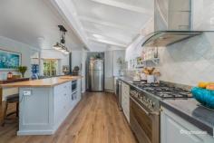  24 Bilga Road Armidale NSW 2350 $840,000 - $880,000 Discover the perfect blend of rural tranquility and modern convenience at this beautifully renovated farm cottage, set on 5 picturesque acres in the serene community of Invergowrie. This property offers a rare opportunity to enjoy the peaceful sounds of nature while remaining just minutes away from essential amenities. Step inside this charming home and experience its tasteful renovation, seamlessly combining modern touches with classic country charm. Ground Level: The open-plan living, dining, and kitchen area creates a warm and inviting heart of the home. The kitchen exudes rustic elegance, featuring an island bench breakfast bar, farmhouse sink, corner pantry, and a large stove and oven. Adjoining the kitchen is a spacious dining area, perfect for family gatherings. The lounge offers a cozy retreat with a wood fireplace, gas heating, reverse cycle air conditioning, built-in storage, and a sunroom that’s ideal for your morning coffee while enjoying views of the property. This level also includes a bedroom, a well-appointed bathroom, and a functional laundry. Upper Level: Upstairs, you’ll find two light-filled bedrooms, creating warm and inviting spaces. A second lounge area offers additional flexibility, while the fully renovated bathroom boasts a calming color palette, a corner bath & shower, refurbished vanity, and toilet. Outdoor Features: The appeal extends beyond the home, with manicured gardens, water features, fruit trees, and a dam enhancing the natural beauty of the property. The five acres on the property have been cleared and creates usable rich land. A new double carport provides convenient parking plus extra parking on the property, and multiple sheds offer ample storage. The BBQ and entertaining area is perfect for hosting family and friends. A stable/shelter area is perfect for horses, while large paddocks offer horse mesh fencing. Separate Studio: Adding incredible versatility, a modern studio with its own private entrance includes a living area, bedroom, bathroom, kitchenette, and reverse cycle air conditioning. This space is ideal for guests, extended family, or a rental income opportunity. This property is a haven for those seeking space, comfort, and the charm of rural living. Whether you’re looking to create your dream hobby farm or simply escape the hustle and bustle, 24 Bilga Road, Invergowrie, is a must-see. 