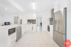  4 Freeman Drive Lochinvar NSW 2321 $1,230,000-$1,280,000 Step onto the sprawling 4252 square metre haven of 4 Freeman Drive in the serene setting of Lochinvar, NSW, where country charm meets spacious family living. This immaculate acreage/semi-rural property offers investors and families an opportunity to enjoy a peaceful lifestyle, complemented by the convenience of local amenities a mere 17-minute drive to Maitland, and the community warmth of nearby shops and cafes. The property captivates at first sight with its incredible street appeal, showcasing a beautiful brick facade set against the backdrop of manicured gardens that promise privacy and tranquillity. The interior echoes this sense of luxury with hardwood, tiled, and carpeted floors that flow seamlessly through the home, adorned with premium fittings and ducted air-conditioning for year-round comfort. Entertain with ease in the open-plan kitchen, living, and dining spaces, where culinary pursuits are a delight in the beautiful chef’s kitchen. It boasts stone benchtops, high-end appliances, two capacious pantries, a breakfast bar, and ample storage solutions. The residence comprises four generously sized bedrooms, each outfitted with ceiling fans, soft carpeting, built-in robes, and ducted air-conditioning. The master bedroom serves as a private retreat featuring an expansive walk-in robe and a luxurious ensuite. The property's practicality is enhanced by a large garage with internal access and additional garage space plus a carport to accommodate up to eight vehicles or various recreational equipment. Outdoor living is a joy with a vast entertainment area and sunroom, perfect for al fresco dining or simply relaxing while overlooking the sparkling pool area. At 4 Freeman Drive, embrace the allure of the countryside with the conveniences of modern living, making this the ideal property to call home. 