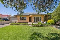  16 Lloyd St St Marys SA 5042 With a north-facing frontage, solid 1960's build and 790sqms (approx.) to play with, this already-extended one-owner home is a must see for families and investors alike. Neat-as-a-pin from start to finish, a spacious lounge and dining room off of the entry hall enjoys natural northern light, the comfort of a gas heater and French doors onto a front porch sizeable enough for sipping a quiet cuppa overlooking the gardens. The original kitchen is perfectly functional as is, with gas cooktop, infinite storage space and plenty of room for helping hands, potential to transform into your dream cooking space when the time is right. Three bedrooms include a roomy master with ceiling fan, and front position with street outlook bathed in natural light, serviced by an updated family bathroom with inset bath, shower and corner vanity. A generous rear extension complete with built-in bar adds another dimension for entertaining and sliding door access onto a fabulous backyard. Here, you'll find a paved alfresco space with pergola overlooking an enormous powered shed, primed for trades or vehicle storage, established landscaped borders and little-leg-approved lawn area, along with an additional entertaining space nestled at the rear where you can enjoy the tranquil ambiance Plenty more to mention: - Ceiling fan to bedroom 2 - Bedroom 3 accessible via hallway or rumpus - Separate laundry & w/c - Fresh carpet throughout Within walking distance of the bus, local playgrounds and reserves, St Bernadette's Primary School and Tonsley precinct. With unparallelled shopping options in every direction (Westfield Marion, Castle Plaza, Pasadena, Mitcham Square) and easy access to the train, Flinders University & Medical Centre, city and sea, it's little wonder this location is so popular. 