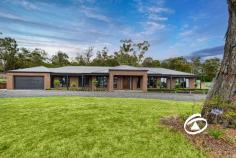  5 Jakobi Court Bunyip VIC 3815 $1,300,000 - $1,400,000 Family Haven on 1 Acre Set on a sprawling 1-acre block, this stunning modern homestead combines luxury living with the charm of country-style tranquility. Located in a quiet, private court, this property offers the perfect blend of space, comfort, and sustainability, making it the ideal choice for those seeking a modern lifestyle in harmony with nature. Offering four bedrooms, each is of generous proportions and feature built in robes and full-length windows with views to the grounds. The primary bedroom distance in design has a walk-in robe and full ensuite bathroom. Central to the design is the stone kitchen with stainless steel appliances and walk in pantry, one can entertain and work seamlessly at the same time. The secondary bedrooms are serviced by a family bathroom. Living areas abound from the formality of the lounge/theatre that can be closed off to the casual and relaxed feel of both the family and rumpus rooms. Each space allows families to gather or retreat. The convenience of ducted heating and split system cooling. The study allows room for one to work from home. A colour filled garden, neatly clipped lawns, together with specimen native trees provide the perfect back drop for kids to roam and room for a future swimming pool. A newly constructed 20x12 m high clearance shed offers four bays, will hold all the toys and more, alternatively one could tinker all day long. Beautifully set, amongst quality housing, the property offers a tremendous platform wanting a semi-rural lifestyle. 