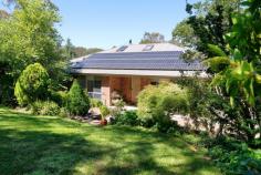  108 Stuarts Road Katoomba NSW 2780 $1,300,000 - $1,400,000 Nestled on a serene 1-acre block, this beautifully designed home offers the perfect blend of privacy, sustainability, and modern convenience. With half the property featuring cool-climate gardens and the other half natural bushland, this retreat is ideal for those seeking tranquility and a connection to nature. Thoughtfully equipped with eco-friendly features and a versatile layout, it's the ultimate haven for relaxed living. Located in a peaceful area with bush walks at the end of the street, this property is truly a rare find. Breakdown of Features: Three spacious bedrooms plus a versatile fourth room for use as a study, office, or music room All-steel frame construction with insulation in the ceiling, internal, and external walls Laminated doors and windows for enhanced security and energy efficiency Open-plan living with a slow combustion fire, natural gas heating, and reverse-cycle air conditioning Modern kitchen with gas oven and cooktop, dishwasher, and ample storage Luxurious bathroom with a spa bath 45,000L water tank for household use plus a 10,000L tank with fire hose for fire safety Solar-powered living with 27 panels and a Tesla battery system Double garage with electric roller door for convenience Landscaped gardens with sprinkler systems, a glasshouse, and plenty of space for outdoor enjoyment Peaceful, private location with bush walks just steps away This property combines sustainable living with unmatched privacy and modern comforts. Don't miss your chance to make this unique retreat your home.  