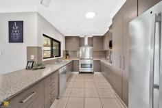  21 Ormond Close Gordonvale QLD 4865 $849,000  Therese Plath welcomes this property to today's market.. 21 Ormond Close, Gordonvale … Experience all this home has to offer! Nestled in a peaceful cul-de-sac, this impressive home sits on a generous 900m² block, offering space, privacy, and a host of premium features. Designed for comfortable family living, this property combines modern style with practical convenience. Interior Highlights: Step inside to discover four spacious double bedrooms, each with built-in wardrobes, air-conditioning, and tiled flooring for effortless maintenance. The master suite is a true retreat, featuring a private en-suite and ample storage. The main bathroom is well-appointed, offering a separate shower and bath and single vanity, perfect for families. The heart of the home is the chef's kitchen, generously proportioned with ample overhead cupboards, plenty of bench space, a 900mm gas stove, a dishwasher, a breakfast bar, and a large pantry. Whether cooking for the family or entertaining guests, this space delivers functionality and style. The open-plan living and dining areas are light-filled and welcoming, flowing seamlessly out to the expansive undercover alfresco area. This design allows for effortless indoor-outdoor living, perfect for enjoying the tropical climate and the view through to the famous picturesque Pyramid. Outdoor Oasis: You will love the private resort-style relaxation in your own backyard! The large undercover patio overlooks a beautifully manicured yard and sparkling swimming pool, providing the ideal setting for weekend barbecues, gatherings, or quiet moments of relaxation. The gardens are lush, tropical, and irrigated for easy maintenance, ensuring a relaxing outdoor space all year round. For those needing extra storage or workspace, the 6m x 6m powered shed offers drive-through access to the rear, ideal for a workshop, hobby space, or additional parking. Plus, there's undercover parking at the front, perfectly suited for a caravan or boat. Additional Features: Fully fenced at the rear for privacy and security Security screens throughout for peace of mind Solar panels to help reduce energy costs Comprehensive security system Located in a quiet street among other quality homes This outstanding property offers a rare combination of space, style, and practicality in a sought-after location. If you're looking for a family home and an entertainer's paradise, this residence ticks all the boxes. 