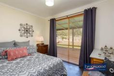  80 Benrua Rd Clackline WA 6564 $680,000 Escape the hurly-burly of city living in this beautifully presented country getaway on 2-hectares in a quintessentially Australian landscape. Designed for rural living, the property boasts fenced paddocks, horse shelters, a powered workshop, a shaded south-facing garden and a spacious chicken coop with a run. The cedar and iron home is a charming blend of modern country and retro flair, creating an inviting and whimsical interior. It’s easy to imagine a happy life lived at a gentle pace in this fantastic country cottage. 3 bedrooms 1 bathroom 1989-built cedar and iron Wrap-around verandahs Principal bed semi ensuite SC fireplace split air-con Flexi-use office/activity rm Paddocks with laneways Workshop & 2-car carport 2-hectares/4.9 acres fenced Classic country retreat Occupying in an iconic Australian setting, this charming rural property offers a serene escape from the pace of city life. The west-facing verandah, shaded by a lattice, provides a breathtaking vantage point for sunsets over the paddocks. At its southern end, a shaded retreat offers a cool, calm sanctuary on warm summer evenings, ideal for alfresco dining under a canopy of stars. The home is designed for relaxed living. A slow-combustion fireplace anchors the open-plan living area, while a timber-lined pitched ceiling and reverse-cycle air conditioning create a cozy yet airy atmosphere. The pine kitchen, complete with an electric wall oven, four-burner hob, built-in pantry, and ample cabinetry, is as practical as it is charming – a window above the sink frames views of the glen-like, south-facing garden. The main bedroom is a tranquil haven, where a large window draws in natural light and showcases the beauty of the surrounding paddocks and gum trees. Neutral tones, a ceiling fan, a walk-in robe, and a semi-ensuite create a comfortable and stylish retreat. Two additional bedrooms, one with a ceiling fan, are conveniently located off the central hallway, which leads to a versatile, light-filled room. Currently styled as a home office, this adaptable space, with direct access to the carport and fenced backyard, could serve as a guest suite, entertaining area, or activity room. Beyond the interiors, the property truly shines. A powered workshop with a lean-to offers space for projects or equipment storage, while three fenced paddocks, some with shelters and water, offer excellent facilities for livestock. A spacious chicken coop and run promise fresh eggs and a taste of farm-to-table living. Whether you’re dreaming of a simpler life immersed in nature or seeking a tranquil country retreat to call home, this Clackline gem offers the perfect balance of indoor comfort and outdoor freedom. With its peaceful setting, versatile spaces, and undeniable charm, this is a rare opportunity to embrace the beauty of rural living. 