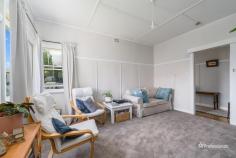  51 Taylor Street Armidale NSW 2350 $440,000 - $480,000 Welcome to 51 Taylor Street, a beautifully presented two-bedroom home in the desirable North Hill area. Perfectly positioned close to public schools and local corner stores, this home offers both charm and comfort in a sought-after location. Step inside to find two generously sized bedrooms, each featuring built-in wardrobes for ample storage. The warm and inviting living room boasts plush carpet, neutral tones, and abundant natural light, creating a cozy retreat for relaxation. The galley-style kitchen offers plenty of storage and flows seamlessly into the adjoining dining area, where polished floorboards and a charming wood fireplace set the scene for memorable family meals. The main bathroom is well-equipped with a shower, toilet, and vanity, while an additional toilet is conveniently located in the laundry. Outside, you’ll love the open and level backyard, complete with beautifully manicured garden beds. A double carport, single lock-up garage, and fully fenced front and backyard ensure security and practicality for any homeowner. Don’t miss this fantastic opportunity to secure a well-maintained home in an excellent location.  