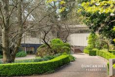  2 Duke St Mittagong NSW 2575 Imagine a residence where every detail has been meticulously crafted to offer unparalleled peace and convenience. Nestled within beautiful native and exotic gardens, this exceptional home presents a serene retreat where privacy and tranquillity are paramount. Situated in a prestigious blue-ribbon locale, locally known as “the Top of the Gib”, it offers easy access to Bowral and Mittagong townships. We would love to introduce you! Features include; Sun-drenched interiors with a cosy lounge area boasting a fireplace, complemented by ducted heating for year-round comfort Inviting outdoor living Effortless flow from the living spaces to a north-facing entertainment courtyard, perfect for relaxing or hosting gatherings Spacious Master Bedroom with walk-in-robe and en-suite Versatile spaces A separate studio or office, ideal for a home workspace or guest accommodation, adds flexibility to your living arrangements Tandem lock-up garage with room for 3-4 cars, workshop and extensive under-house storage Enjoy the immediate comfort and liveability with exciting possibilities to personalise further and enhance the property 