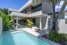  70 Acanthus Avenue Burleigh Heads QLD 4220 $2,895,000 Experience modern luxury in this stunning two-level home, perfectly located just 800m from the iconic Burleigh Beach and moments from the vibrant James St precinct. Designed for those seeking a premium lifestyle, this low-maintenance showstopper promises elegance, comfort, and convenience. This architecturally designed home boasts sleek finishes throughout, with expansive living areas on both floors. The open-plan lounge and dining zone on the ground floor flow seamlessly to a covered alfresco terrace, perfect for entertaining in any weather. Fire up the built-in BBQ for effortless weekend gatherings while enjoying the sparkling in-ground pool. Upstairs features three spacious bedrooms, including a luxurious master suite with a walk-in robe, chic ensuite, and a private balcony with city views. A second bathroom and study nook complete the upper level. The fourth bedroom, complete with an ensuite, is conveniently located downstairs, ideal for guests. Leave the car at home and explore the sought-after neighbourhood on foot. Enjoy breakfast at Tarte Bakery & Cafe or a coffee catch-up at Social Brew. Savor dinner and drinks at popular spots like Justin Lane, and Burleigh Pavilion. With world-class beaches, a pristine national park, wellness amenities, and boutique shopping nearby, this vibrant area has everything you need. Property Features: • Contemporary two-level design just 800m from Burleigh Beach • Sleek kitchen with premium Fisher & Paykel appliances • Open-plan living and dining with double-height ceiling void • Covered alfresco terrace with built-in BBQ • Sparkling in-ground pool and low-maintenance gardens • Four spacious bedrooms and three contemporary bathrooms • Master suite with ensuite, walk-in robe, and balcony with city views • Built in 2019 with builder warranty remaining • Ducted MyAir air conditioning with 8 zones • MyAir/MyPlace/MyLights smart home system with keyless entry • Dorani security entry and alarm system • Electric blinds and architectural lighting • Remote double lock-up garage 