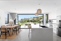 12B Beach Road Stanwell Park NSW 2508 Welcome to 12B Beach Road, Stanwell Park, a stunning coastal residence which perfectly captures the essence of beachside living, blending contemporary aesthetics with relaxed elegance. Ideally located for those seeking the advantages of low-maintenance coastal life in a desirable area - only 200m to the ever popular Stanwell Park beach. What You Will Love: • Bright and Airy Atmosphere: This tri-level home is filled with natural light and refreshing ocean breezes, creating a welcoming ambience. • Stylish Layout: Enjoy three spacious bedrooms, two modern bathrooms, and inviting living areas designed for comfort offering polished burnish concrete floors, ducted air throughout and top of the Bosch appliances and finishes with Italian made E1 hydraulic lift access to all levels. • Gourmet Kitchen:On the first floor, the seamless integration of living, dining, and kitchen areas creates an inviting space for gatherings or relaxation, with the option to enjoy the peaceful courtyard or the spacious alfresco balcony capturing the stunning beach , surf and coastal views. • Outdoor Space: Expansive balconies on two levels capture unobstructed east facing views of local beaches and west to the escarpment, as well as a private courtyard. Each are perfect for relaxing or entertaining after a day at the beach. • Characterized by modern coastal living : the upper level of the residence features three bedrooms, two bathrooms, and a bonus study / flexible living area, all accentuated by soaring ceilings. The master suite boasts a balcony offering stunning beach, ocean and escarpment views, complemented by a modern ensuite and walk-in robe, providing a luxurious retreat after a day under the sun. • Easy Living: Ideal for both short getaways and full-time living, this home offers an enjoyable low-maintenance lifestyle just 200 meters level stroll to the beach and offering stunning ocean and escarpment views, low maintenance gardens and is less than one year old. Property Highlights: Near new Torrens title home. Two modern bathrooms with heated floors, the main bathroom with stand alone bathtub Open concept kitchen, dining, and living areas with polished burnish concrete floors High quality appliances and fixtures throughout A bonus study / flexible living space Balconies taking in the spectacular ocean and escarpment views. In addition to a private courtyard for outdoor entertaining Landscaped yard designed with coastal terrain and established gardens Indoor/outdoor flow with multiple glass sliding doors optimising the stunning views Ample Storage options Oversized two car garage + storage Italian made E1 hydraulic Lift accessing all levels Ducted air throughout as well as a 74 inch wall mounted fireplace Security cameras Location: Only 200 meters to the beach and parks with spectacular uninterrupted views Short stroll to Stanwell Park Village; cafes and shops 5 Minutes to train station One hour to Sydney CBD 30 minutes to Wollongong Experience the best of coastal living, where every detail has been carefully crafted for your enjoyment and comfort. 