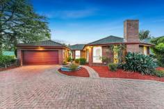  12 Mockridge Street Wantirna South VIC 3152 A spectacular blend of relaxed comfort and family flair, this 4-bedroom corner of the block home is a stunning beauty! Graced with a plethora of space both inside and out, this solid brick single storey residence makes an amazing first impression with a generous living space with designated lounge and dining areas along with an abundance of natural light and a cosy fireplace. A lengthy family zone will be an entertainment hub with easy access to the casual meals and central kitchen featuring slate tiling, SS gas appliances and lots of bench space. The expansive master retreat boasts a walk-in robe and an ensuite, 3 other bedrooms with built-in robes. A wonderfully huge bathroom comes with a separate bath and separate toilet and a laundry with rear door. An added bonus of a well-sized yard and garden at the rear makes this home great for summer entertaining upon the exposed deck. While it also features, ducted heating, evaporative cooling, workshop and a double garage with numerous access points. In a stellar location only a stone's throw to, Knox Gardens Primary School, Scoresby secondary college, Swinburne University, Eastlink, transport options and Westfield Knox for shopping. 