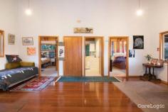  425 Friday Hut Rd Possum Creek NSW 2479 $2,900,000Now is the time to seize your dream of an idyllic life and make it a reality, rarely are acres like this offered for sale in highly sought after Possum Creek, a perfect setting just minutes from Bangalow and a short drive to Byron Bay. This 15 acre property affords privacy, peace and tranquility in a private setting overlooking arable paddocks fronting the Wilson River. The original owners of this four bedroom timber home have been there for nearly 50 years and reluctantly present their much loved property for sale. The red cedar home is nestled on hilltop cleared acres with elevated views to the Nightcap Ranges, the pristine waterway and riparian forest below. It offers four bedrooms, two bathrooms, a snug lounge, kitchen and open plan living area plus a second living space. There is a magnificent deck of grand proportion connecting the two wings of the home forming the true hub and heart of the home. Timber verandahs frame the views, an open fireplace creates warmth and security, timber polished floors and timber panelling define character and charm and raked ceilings enhance the country homestead feel. For the horse enthusiast you need look no further. The property offers covered yards, stable, tackroom and numerous shed and storage facilities. Established trees and gardens surround the home which is well protected and private from Friday Hut Road.. There are gentle paddocks with ample shade trees and water can be pumped from the Wilsons River. This is a home full of potential in an iconic location offering privacy, proximity and peace. Dreams do come true so seize the day! 