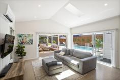  6 Rosedale Avenue Keiraville NSW 2500 Conveniently set in a quiet cul-de-sac on a generous 739.8m² block, this three-bedroom home offers the perfect balance of style, comfort, and functionality. Bathed in natural light, the home welcomes you with its thoughtful layout and modern features. The main bedroom is a private retreat with a coveted walk-in wardrobe and a luxurious ensuite featuring a double sink, double shower head, a separate tub, and heated towel rails. The additional two bed-rooms include built-in wardrobes and fans, ensuring ample storage and comfort for the whole family. At the heart of the home, the chef's kitchen boasts sleek stone bench tops and a generous walk-in butler's pantry where your organisational skills can truly shine. An impressive pitched ceiling elevates the living room to new heights for added charm and warmth, while a fireplace and split-system air-conditioning set the tone for cosy evenings at home. Step outside into an entertainer's paradise. An in-ground magnesium pool complete with an outdoor shower offers resort-style fun for all ages. While the bar area, featuring a fridge and pizza oven, is perfect for relaxed get-togethers under the sunset sky. Features • Built in 2020, polished concrete floors, retractable skylight • Magnesium pool with reverse cycle pump for heating and cooling • Outdoor bar with pizza oven ideal for backyard hosting, shed • Double garage, door camera, 2 x water tanks, 15.3KW solar system • Modern kitchen with butlers pantry, electric cooktop • Moments to Botanic Gardens, village shops and UOW 