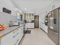 10 Knight Street MOUNT PLEASANT QLD 4740 This beautifully presented low-set brick home is perfectly positioned in a highly sought-after location, offering ultimate convenience. Within walking distance to schools, public transport, and local shops, this home is a must-see! Situated on a spacious, flood-free 801m² corner block with dual access, the property provides the ideal foundation for easy family living. The home features a practical, open layout with spacious living and dining areas that flow seamlessly to a large, covered outdoor entertaining space. The near-new kitchen is a standout, offering plenty of storage and modern finishes. Boasting three good-sized bedrooms, all with built-in robes and ceiling fans, plus an office that could easily be used as a fourth bedroom, this home offers flexibility to suit your needs. The renovated bathroom, separate toilet, and tidy laundry with direct access to the large backyard make this home even more appealing. Immaculately maintained inside and out, this home is ready for a new family to move in and enjoy. Features at a glance: • Elevated flood free position • Fully fenced 801m² corner block with dual access • Near-new kitchen with ample storage • Three bedrooms with built-in robes + 4th bedroom / office • Renovated bathroom & separate toilet • Split system air-conditioning in (3) bedrooms and living area • Ceiling fans throughout • Fresh, neutral colour scheme with tiles all over • Security screens on all windows and doors • Single garage with remote access • Walking distance to schools, shopping, and dining options • Discounted rates $1,875.34 • Rent appraisal $640 to $660 per week 